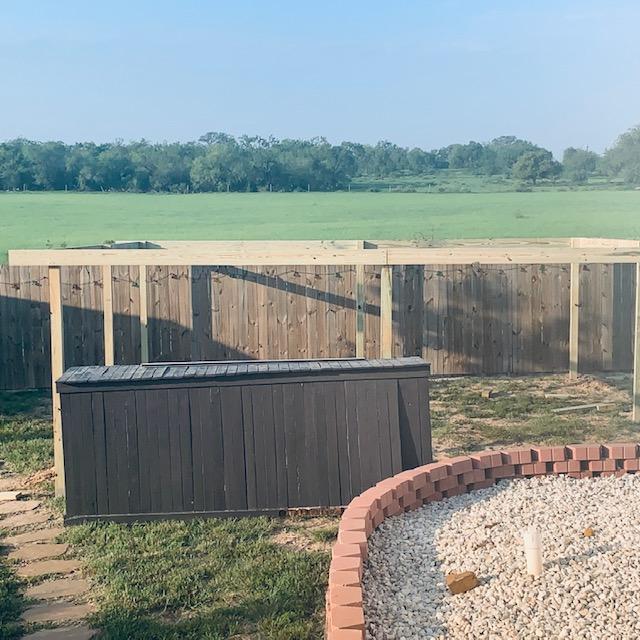 This is the frame for my outdoor plant area by the greenhouse. Our pool bar is there right now but I think we will move it closer to our deck.