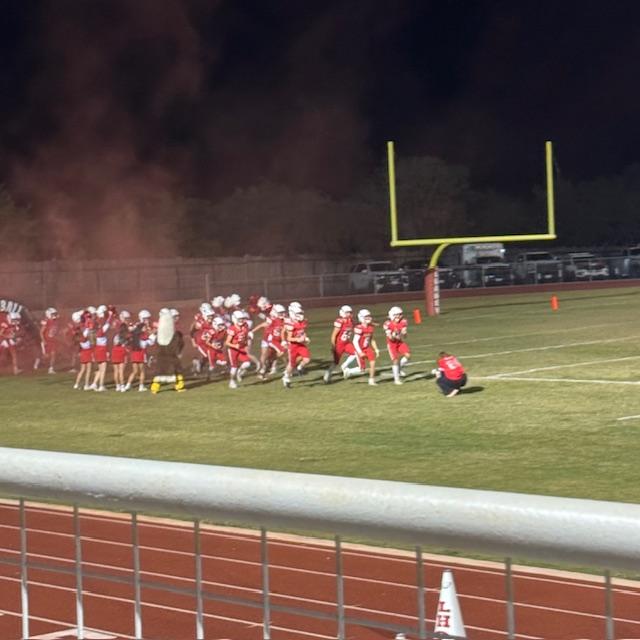 The 2025 Leakey football team came out of the blowup with red smoke running. David said the 1975 team considered it but decided to walk instead! Lol!