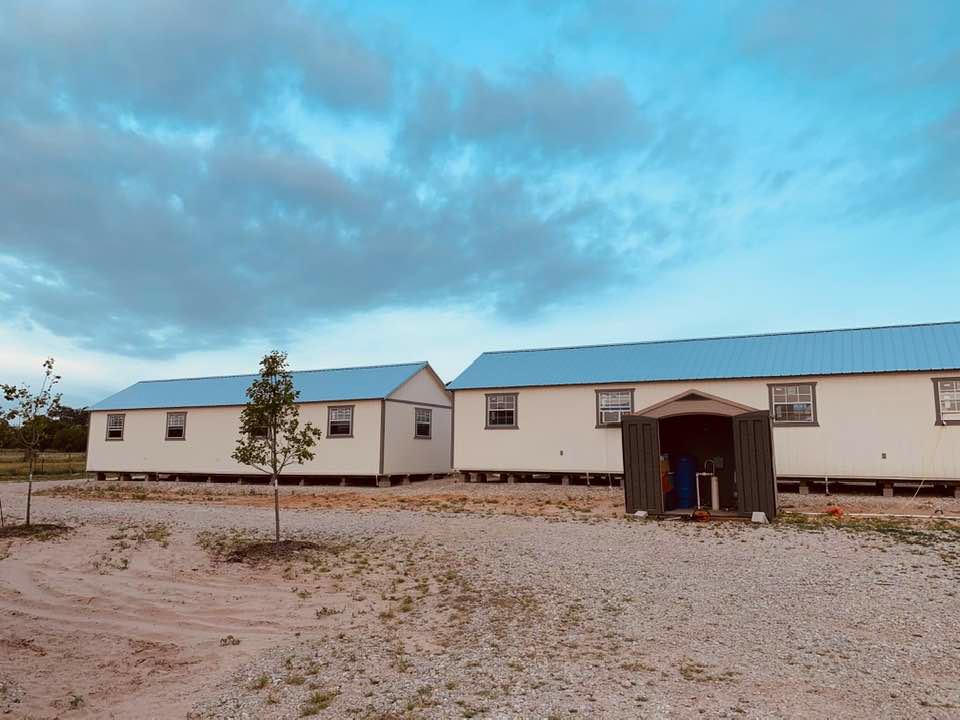 Our new view from our front deck of the two business buildings. The one on the right will house David and the seeds. The other will house our seed workers.