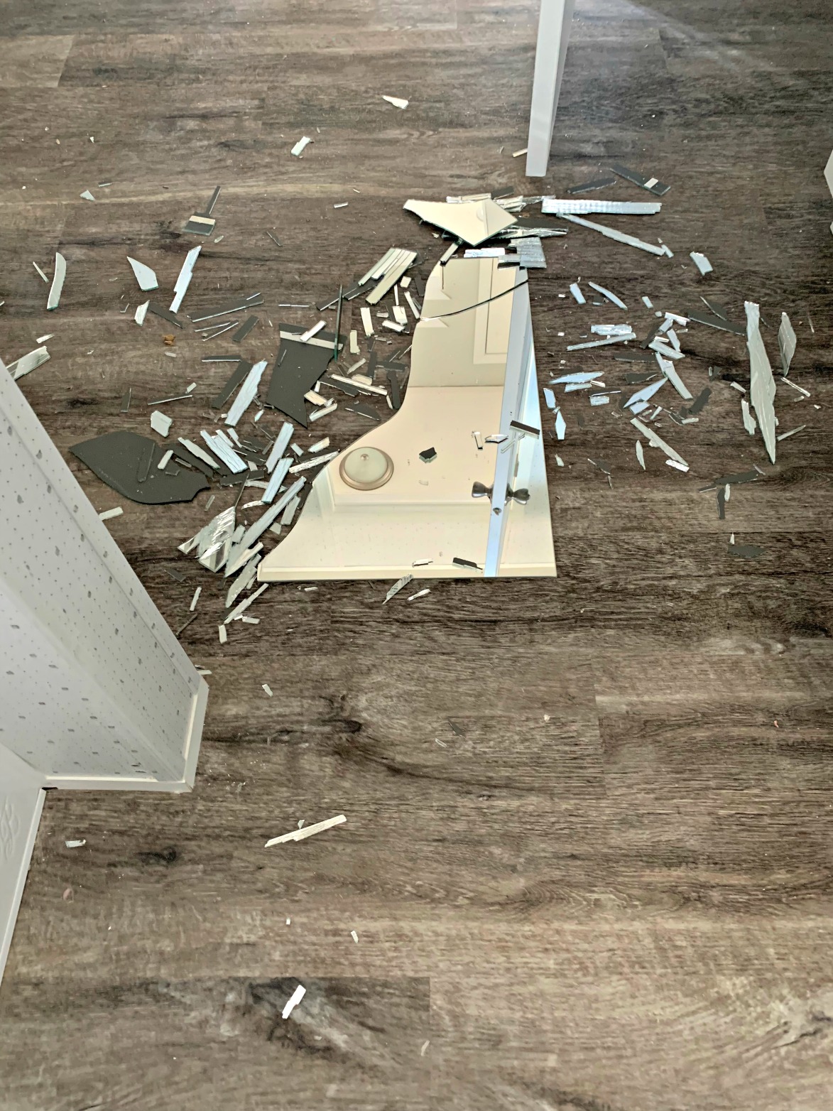 The broken mirror is in a thousand or so pieces all over the bathroom floor due to transport of home when moving out of San Antonio.