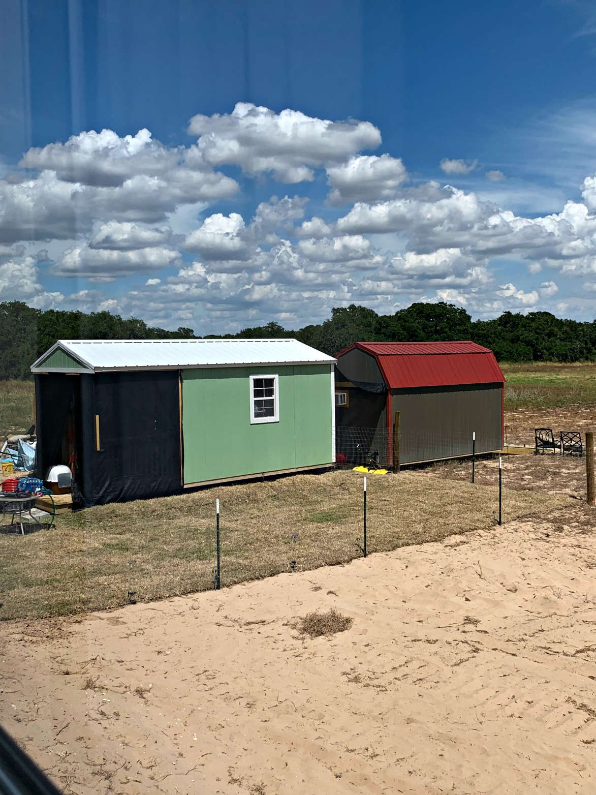We live in the mint green shed until Palm Harbor Homes and the water and electric companies get their acts together and allow us to live in the home we bought that is sitting there vacant.