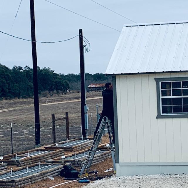 Austin is on a ladder on the north side of Fulfillment.