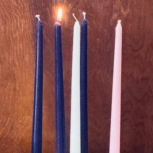 One purple candle is lit for the first Sunday of Advent in church as we celebrate Advent, or the coming of Christ as a baby.