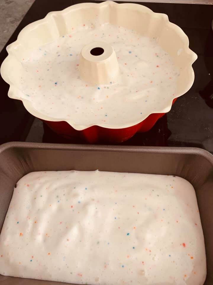 Angelfood cake I made this morning. Had to pour overflow batter into a loaf pan. My bundt pan is not big enough.