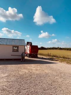 The Apache trash truck finally showed up three days late. Trash blew all over the four acres.