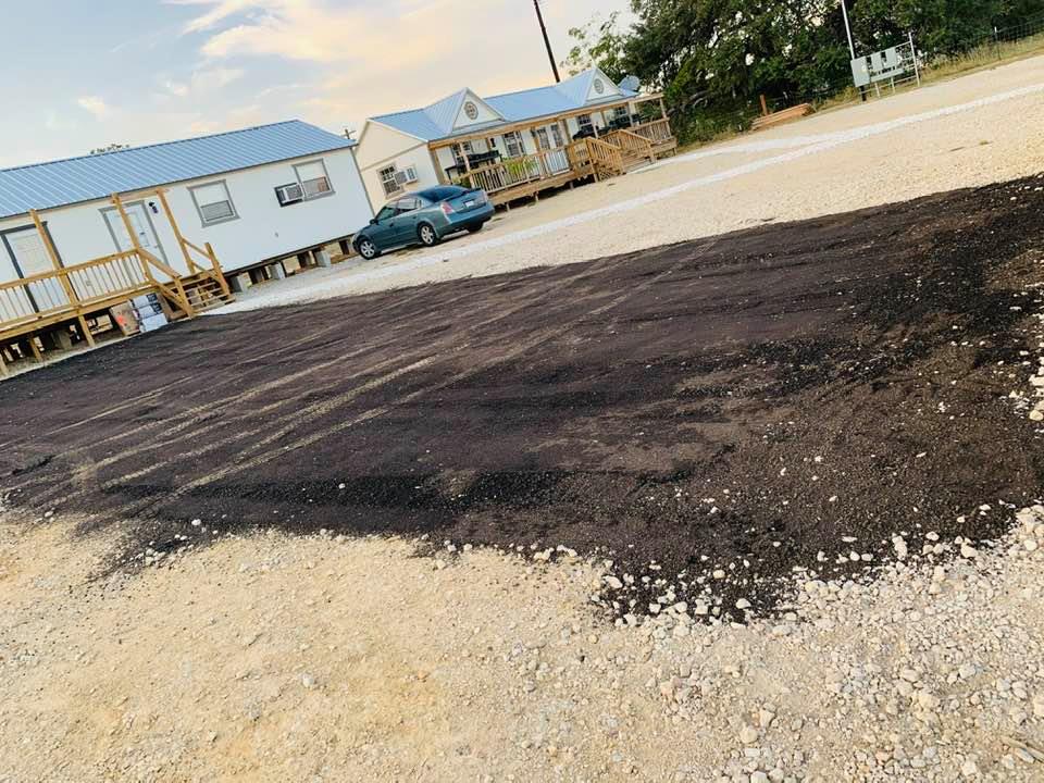 The finished patch of $800 asphalt.It looks nice but is nothing compared to the big parking lot and driveway we have.