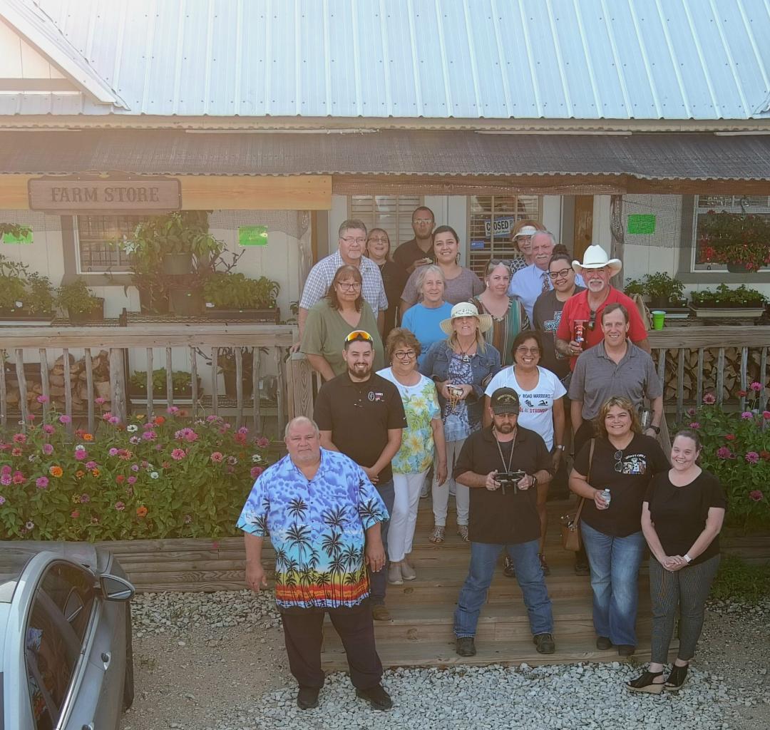 David is down in front and I am in the last row by my son, Matt. We are on the steps of our farm store. Yes, this shot was taken by the drone.