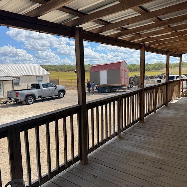 They spent the better part of 2 hours trying to load the shed but the trailer was not wide enough. They finally left.
