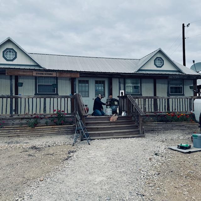 Nacho and Seth getting ready to paint the store green.