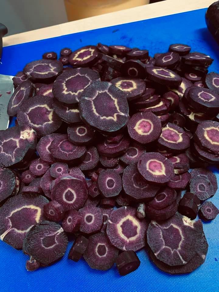 Our beautiful Black Nebula carrots grown here in our garden. They have a white circle when sliced. It disappears when cooked. They are the sweetest carrots I have ever eaten.