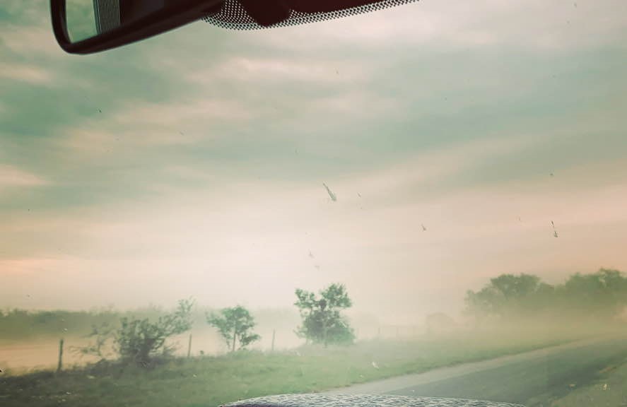 The sand is blowing heavily across the road as we drive to church this morning.