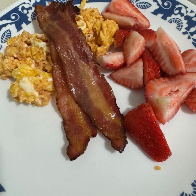 This morning's breakfast--amazing scrambled eggs with cheese & salsa cooked in them, bacon, & fresh strawberries. So good!