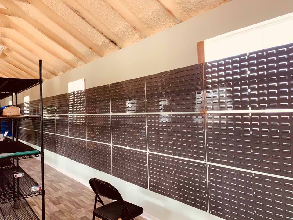 Seed grids are being hung in building 2 as well as lots of shelves to hold the seeds.