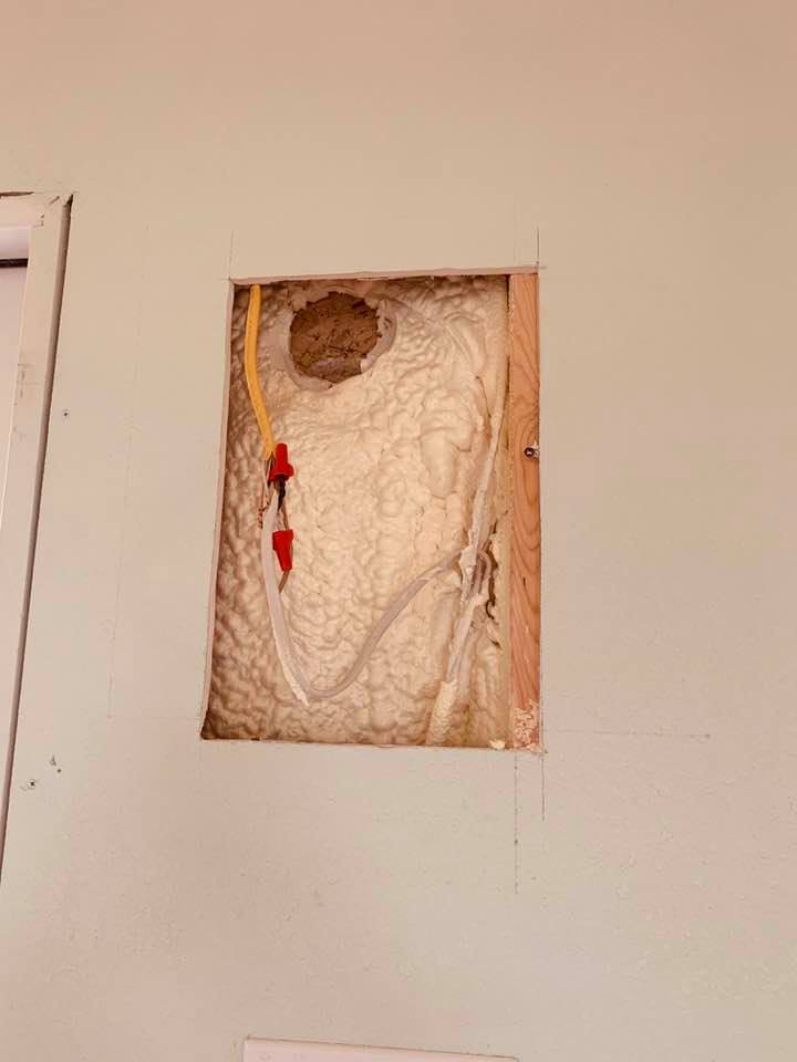 This is the hole in the wall in building 3 where the electricity had to be repaired. Now we have to wait for the contractor to come and redo all of this work that we paid for.