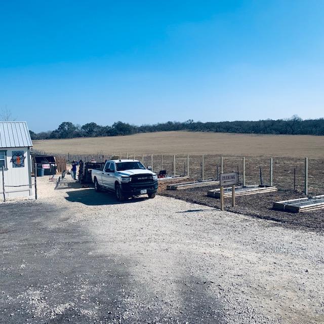 Nacho and his team took down part of our old fence by the hay field to put up a new wooden one with a gate so people don't drive up the back 40 and get stuck.
