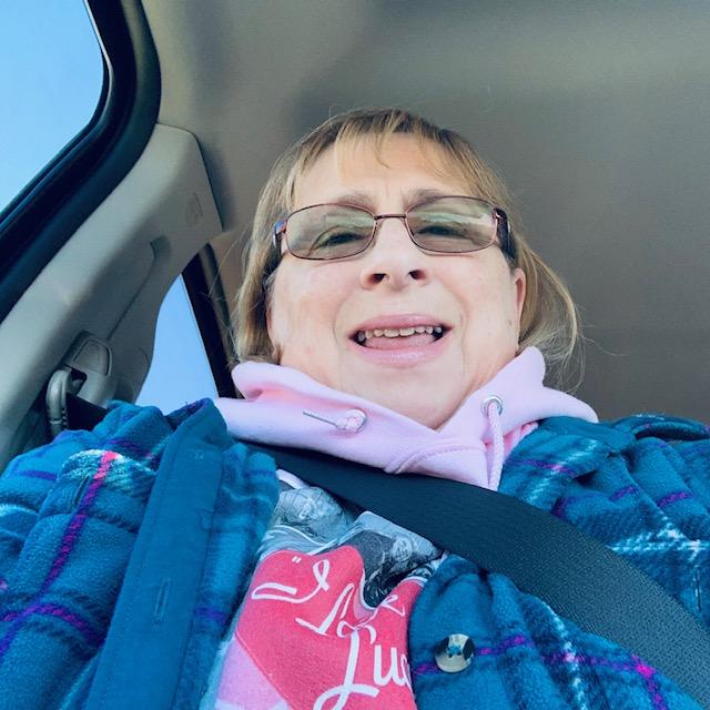 In the truck, bundled up for church with my jacket, my I Love Lucy hoodie, and a matching T-shirt. It was freezing in the church so I am glad I was prepared.