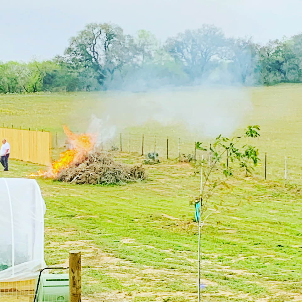The burn pile is going in the farm yard. Don't worry; we called and got permission.