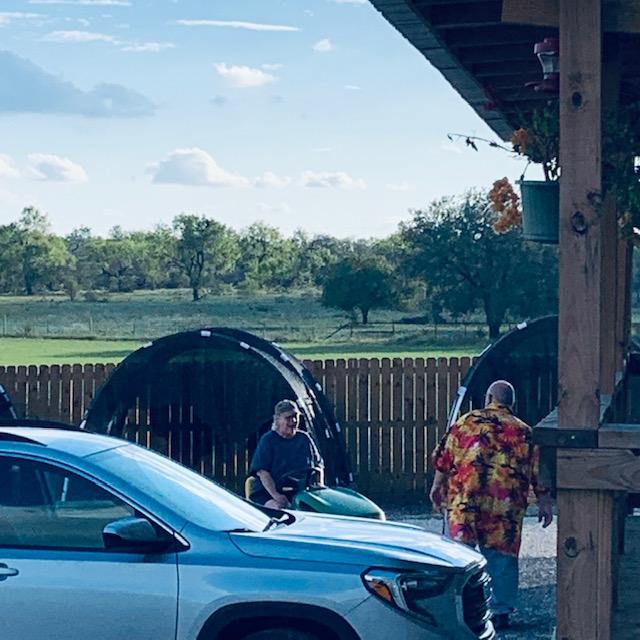 Carolyn drove over with dinner on her John Deere mower. She is a great cook. David heard the mower and came out of his office. I heard it, too.