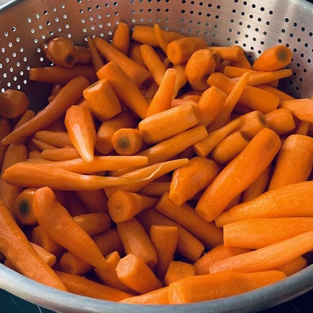 2 of our people washed and peeled the carrots that were harvested.