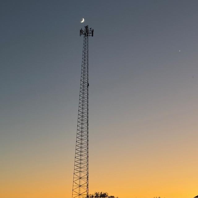 You can see the man climbing down the tower in the dark.