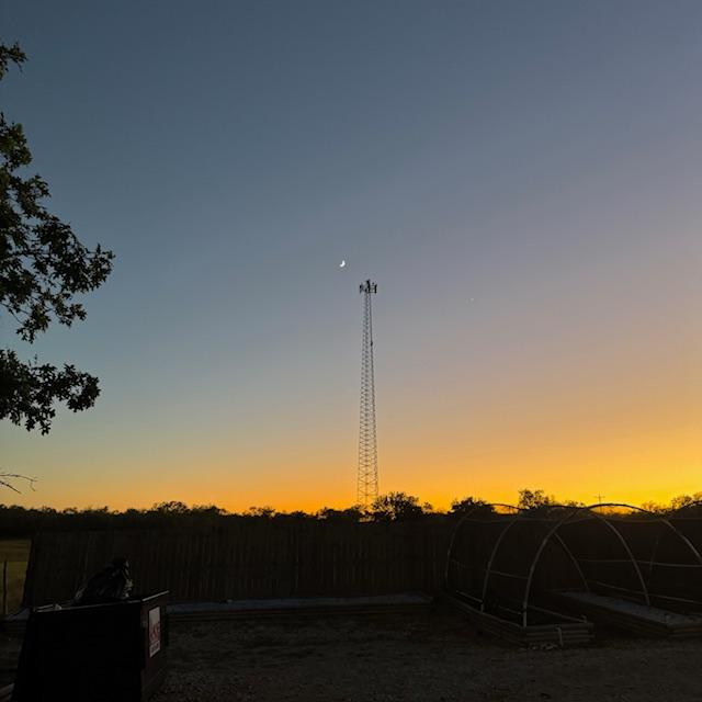 I thought the crescent moon looked pretty by the cell tower. Then I saw the man on it.