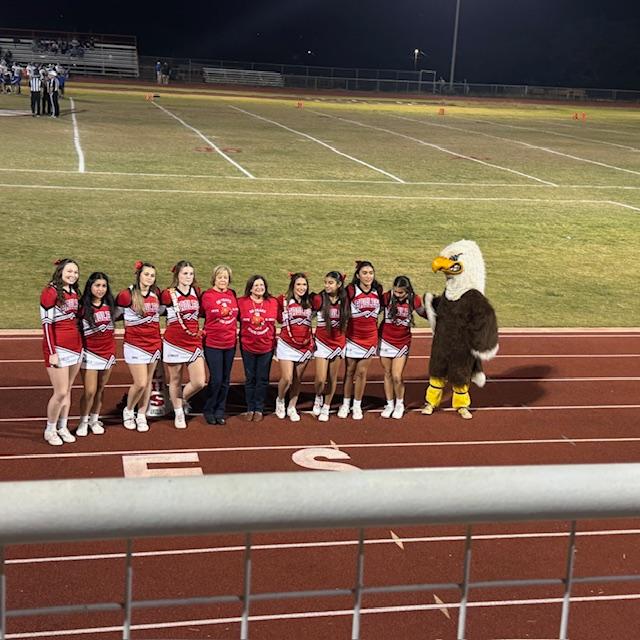 2 of the 1975 cheerleaders joined the kids for a cheer and photo.