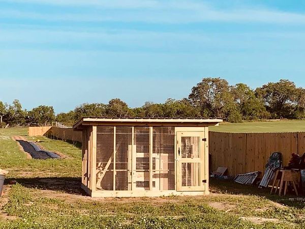 Our chicken coop that was first built, before the run back in spring of 2020. Note the long fence to the right of it that we built. Fencing keeps things separated which is necessary.