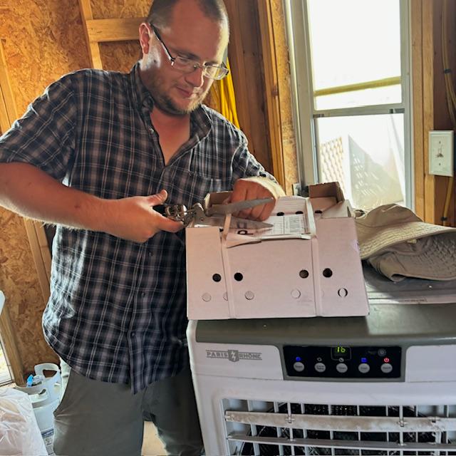 Matt cut the box open and we found 16 beautiful, healthy chicks peeping because they were hungry and thirsty.