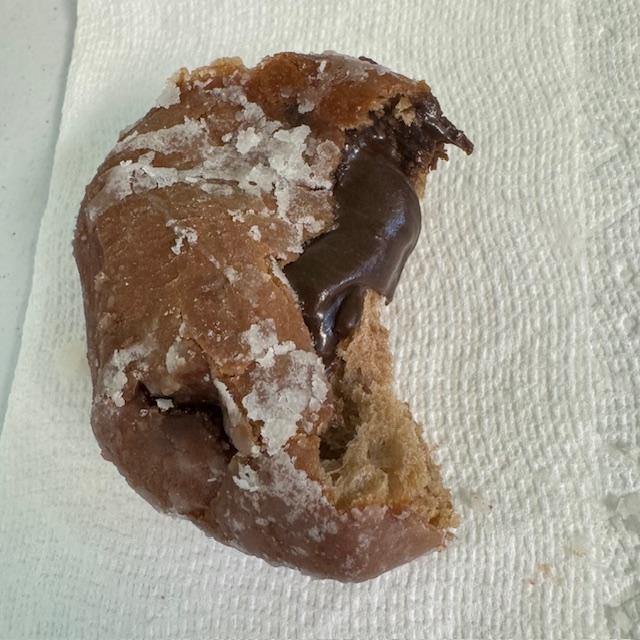 Look at this beautiful donut, filled with chocolate filling, probably more artificial flavors in our food...Someone special just couldn't resist!