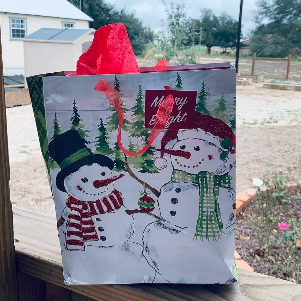 Here is a bag of goodies for my store assistant. She has done a wonderful job for us this year, not only in the store but doing a lot of computer work. This bag is such a pretty Christmas ornament.