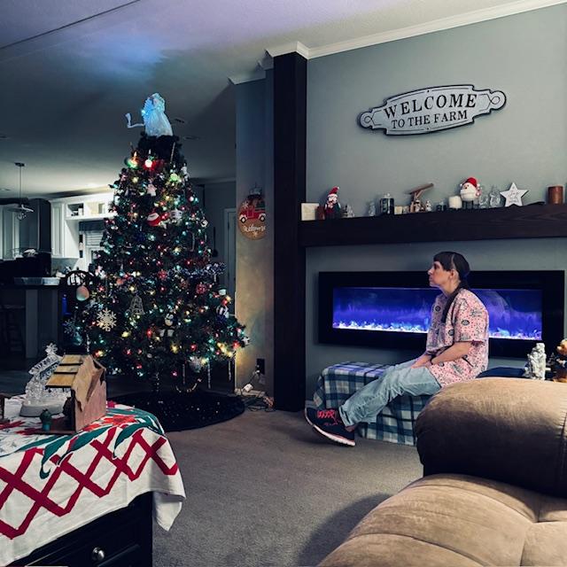 Norma decorated the tree and house for Christmas.