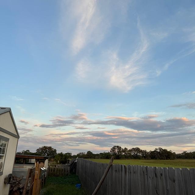 These colorful clouds were there when I put the chickens away this evening around 8pm.