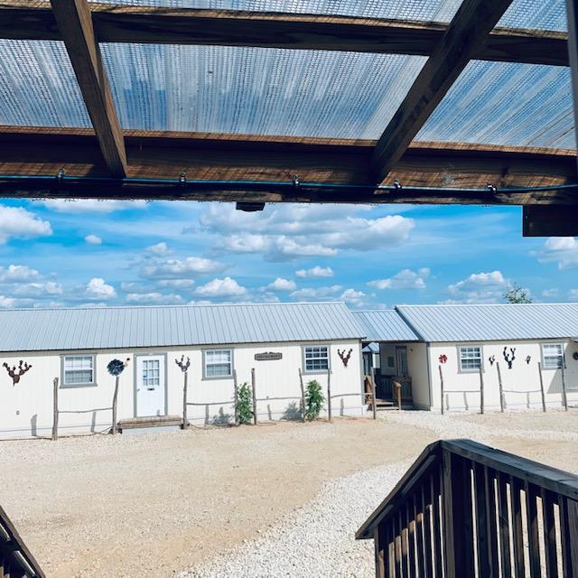 Fluffy clouds grace the sky. Taken from the store porch looking at Fulfillment and Production.