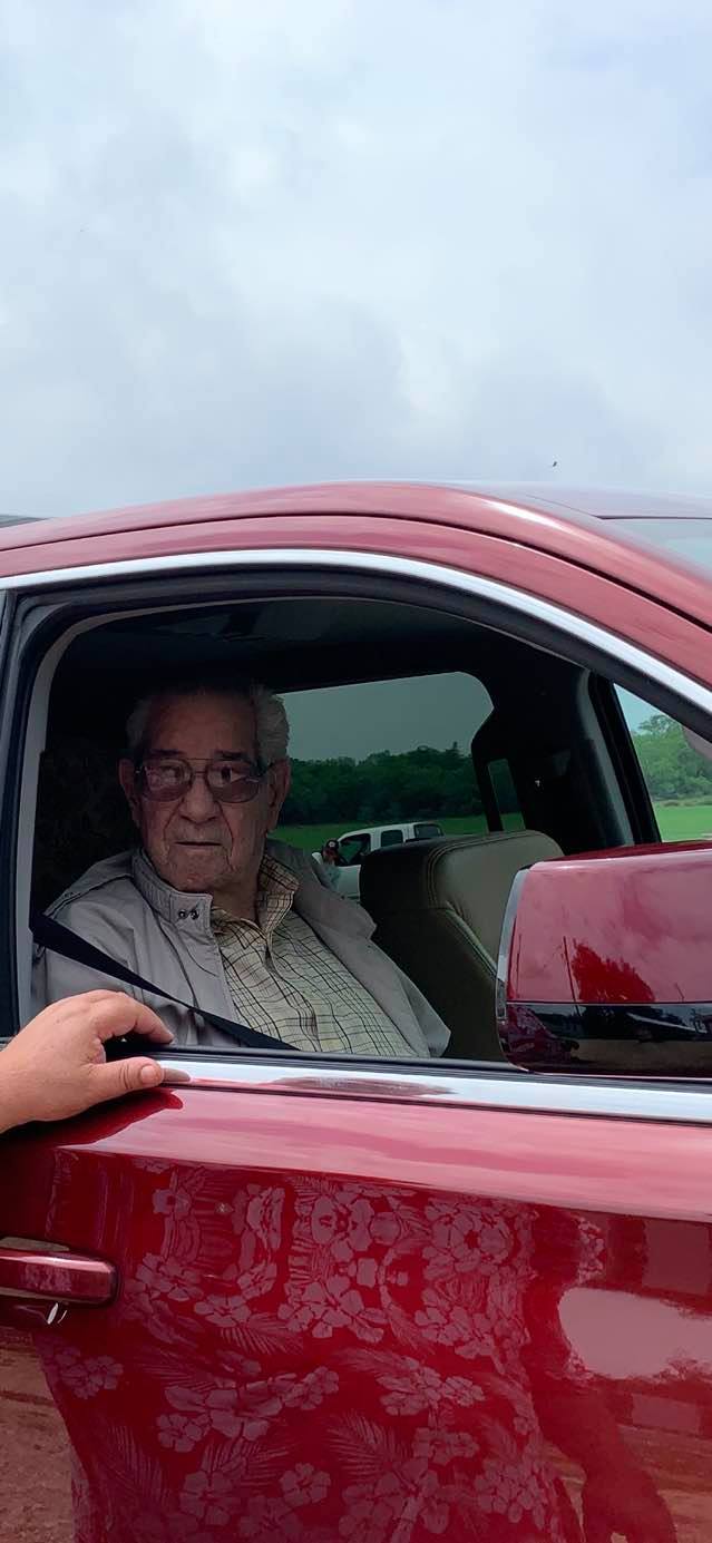 Clyde in the vehicle with David talking to him.