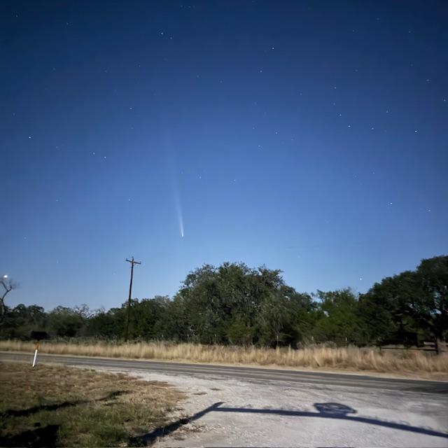 I had to walk all the way to the front gate to find the comet because it was so faint and low on the horizon.