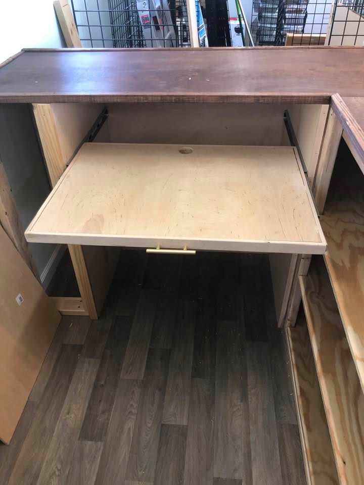 The pull out desk is sturdy.