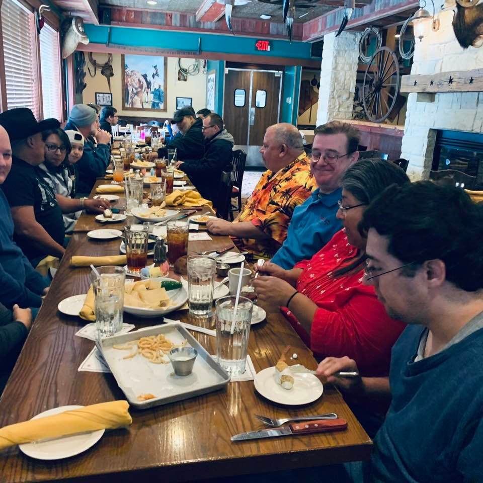 Another shot of this part of the table without me. On the left in the black cowboy hat is Nacho who builds a lot of our wooden projects, the gazebo with pond, animal coops...