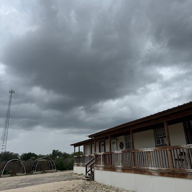 The dark clouds this afternoon finally brought a bit of rain this evening along with lots of thunder. The dark clouds this afternoon finally brought a bit of rain this evening along with lots of thunder.