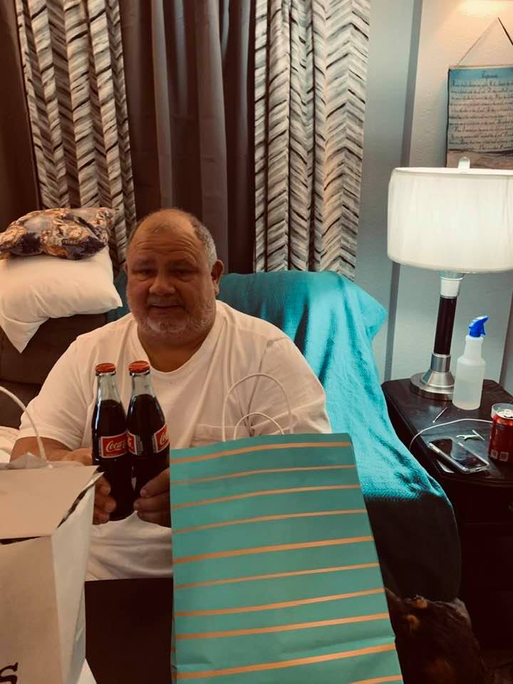 David opening some gifts in the den.