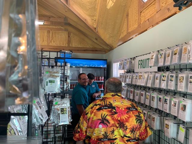 Comfort Commander (Austin & Daniel) in the house or farm store, fixing the commercial fridge. David came in to say hi.