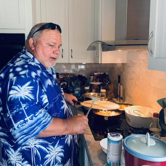 This is David cooking in our home kitchen. If you stay long enough, you will probably see him walking from one building to another or out back taking care of plants.