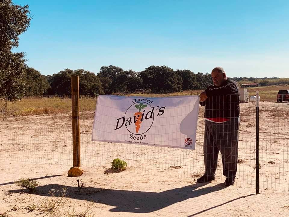Back before our fancy gate, we put up a vinyl sign on our fence advertising the best garden seeds.
