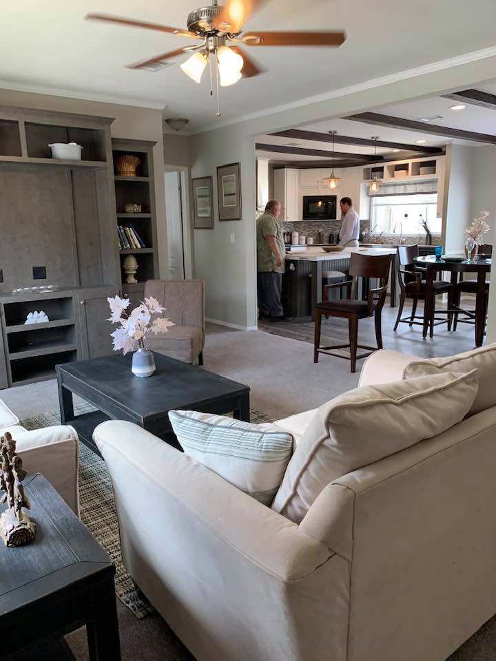 Manufactured Home Plans seem alike but are different. David and salesman in the manufactured home we almost bought. I later realized it was just too small.