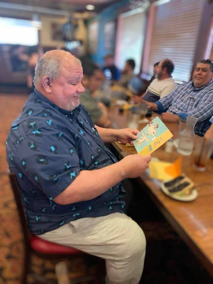 David reads his team birthday card with a slice of cake while Jay, our production manager, looks on. We had 25 for lunch at Salt Grass! Fun times. David reads his team birthday card with a slice of cake while Jay, our production manager, looks on. We had 25 for lunch at Salt Grass! Fun times.