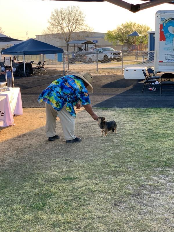 David loves dogs. No, this is not one of ours. This is from last Saturday night's concert. David couldn't help himself, feeding a stray...
