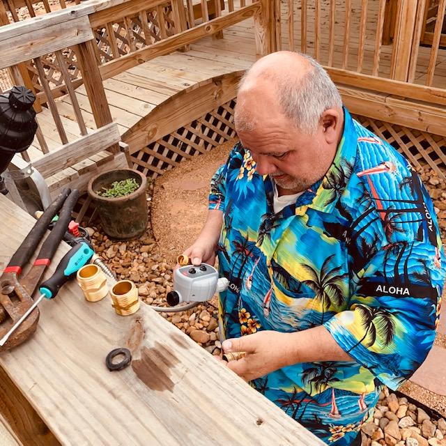 David is putting a new timer for our NPK fertilizer that will go to the raised beds around the Farm Store.