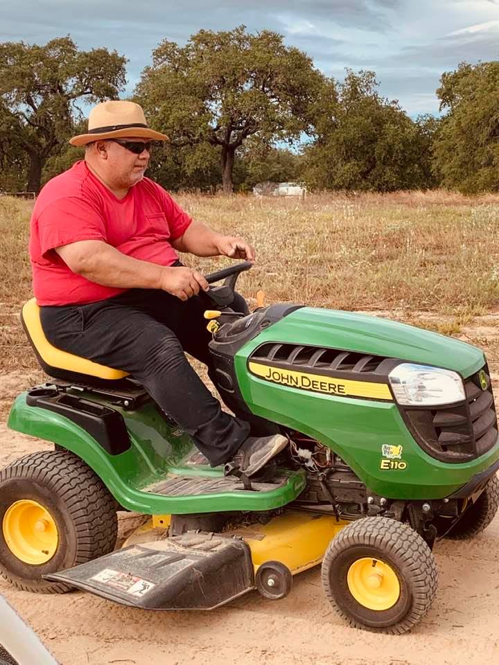David of David's Garden Seeds® zipping along on his little tractor across the farm. He is having a blast!