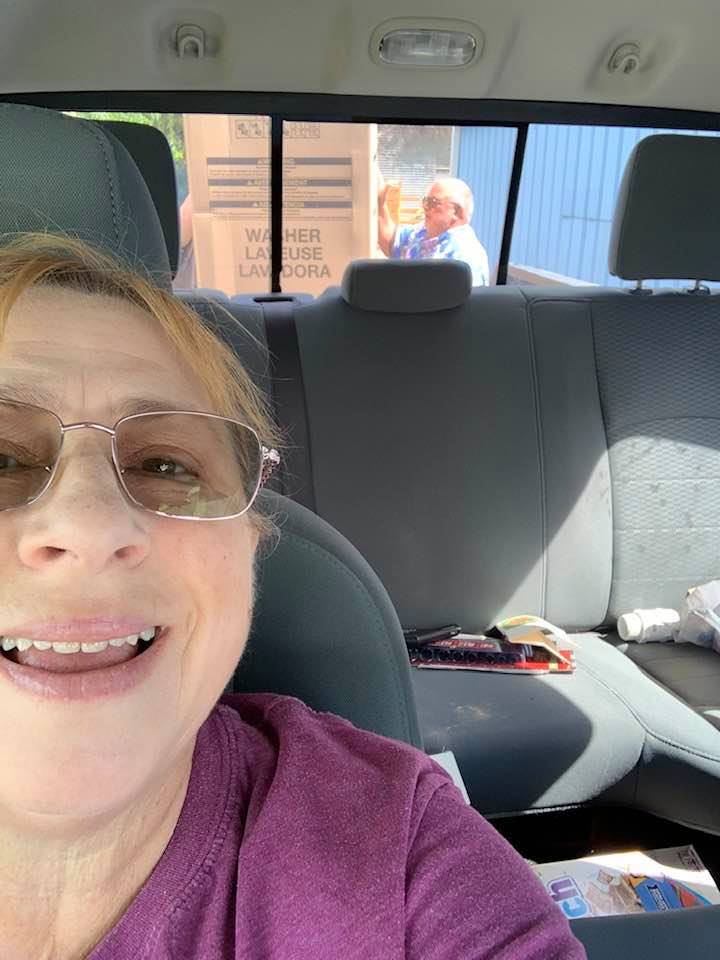 I am back in our truck and David is making sure the new washer is loaded properly.