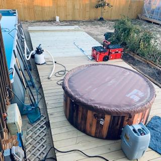 The hot tub that David got me for Christmas is on the deck that is being finished up.