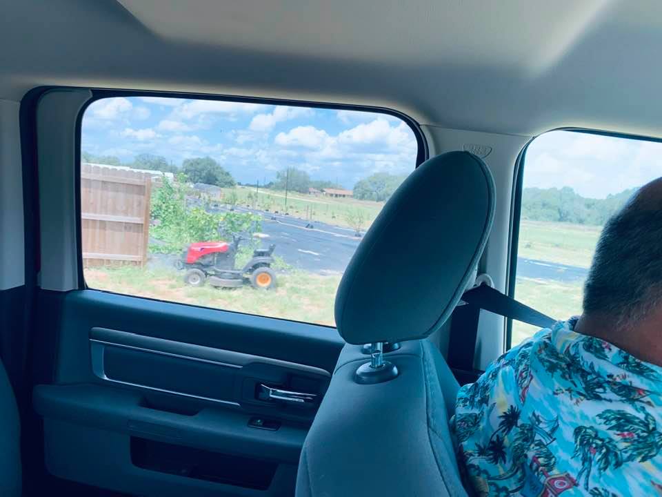 We drove the truck out back and there is the riding mower brought over a month ago that the guy won't come get.